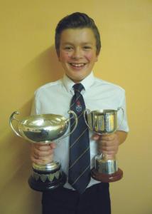Young golfer: Abe with his two trophies.