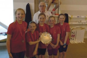 Lamphey Primary School’s winning girls relay team: With Mr Bob Adams who has recently been awarded the Life Time Achievement Award from Swim Wales.